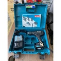 Máy khoan búa vặn vít dùng pin Makita HP333DWYB 12V - Dung lượng pin 1.5Ah, mâm cặp 10mm