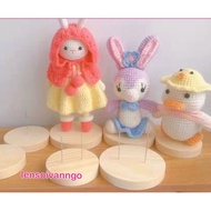 Wooden base holds stuffed animals