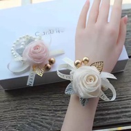 Bride and bridesmaid wrist corsage