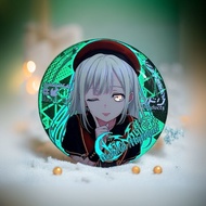 Ave Mujica reflective badges, bag charms