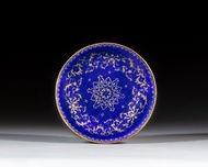 A gilt-decorated basse-taille blue-enamel dish, Seal mark and period of Qianlong | 清乾隆 銅胎畫琺瑯藍地描金皮球花紋