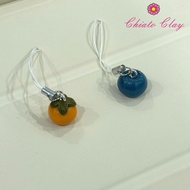 Persimmon and blueberry phone strap