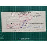 old cheque with stamp. First Commercial Bank
