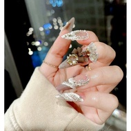 67 Nailbox designs, white rhinestone color with lady's bow charm