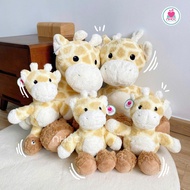 Giraffe stuffed animal wearing fuzzy socks - CHILD