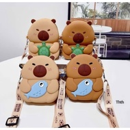 Capybara shaped silicone crossbody bag holding fish, holding strawberries, holding ice cream, huggin