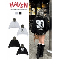 Loose-form hoodie with number 90 printed and Haven Studio camouflage camo hat in thick crab felt in 