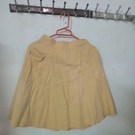 Yellow flared skirt.