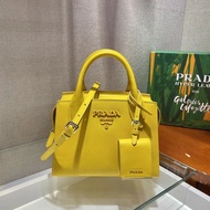 New Female Bag 1BA269 This Double Handle Saffiano Leather Handbag Design Is Perfectly Matched with C