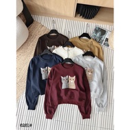 Felt shaped like 2 cats