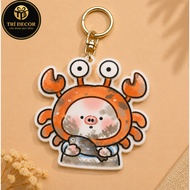 Innocent piglet keychain with bewildered look in a giant crab suit
