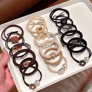 Set of 6 hair ties in various styles with FLOWERS and charms in striking beige brown color for women