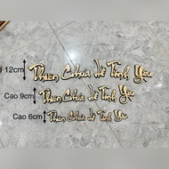 Wooden letter set " God Is Love" decorates the Catholic Altar