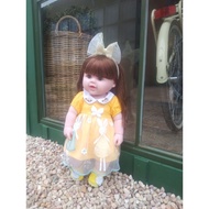 Reborn embroidered dress doll