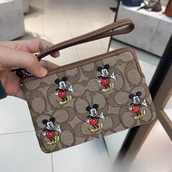 ＜102＞Coâćh_ X Disney กระเป๋าสตางค์ลายการ์ตูนคริสต์มาสที่ร่วมแบรนด์  CN031 CN033 CN025 CN026 CN005