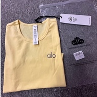 alo/Sell alo Shirt Pastel Yellow Short-Sleeved Crop Top Stretchy Fabric With Brand Logo Embroidery.
