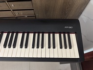 Roland fp30 digital piano with wooden stand.