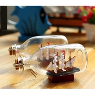 Boat in a luxurious and meaningful gift bottle V3 (14x6cm)