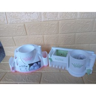 Toothbrush shelf with toothpaste slot