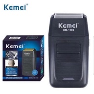 Kemei KM-1102 แบบชาร์จไร้สายเครื่องโกนหนวดสำหรับผู้ชายใบมีดแฝดลูกสูบเครามีดโกนใบหน้าดูแลมัลติฟังก์ชั