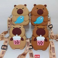 Capybara shaped silicone crossbody bag holding fish, holding strawberries, holding ice cream, huggin