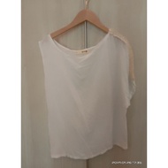 Beige colour blouse.