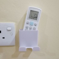 Tempat letak remote aircond, kipas dan cas telefon.
