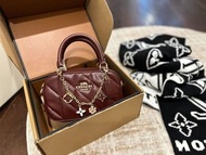 Coach Burgundy Diamond Quilted Mini Boston Handbag with Floral Charm Crossbody Strap