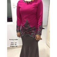 Baju kurung moden bermanik