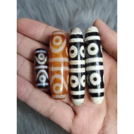 Auspicious 8-eyed Dzi supports fortune, trade and luck