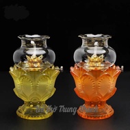 Glass lotus oil lamp.