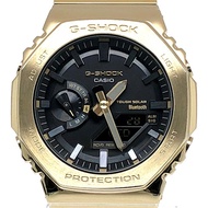 卡西歐 G-SHOCK GM-B2100GD-9A 全金屬金色 IP 太陽能腕錶，配備藍牙、手機連接、雙 LED 照明、八角形設計、橡木指針/數位雙顯。 2023 年 3 月發布。可在 Mikunig