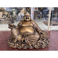 Matreya Buddha statue against holding a gold bar made of feng shui brown brass, LxWxH: 29x20x20cm, w