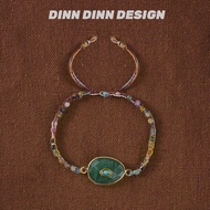 DINN DINN DESIGN | สร้อยข้อมือพู่สีเขียวประดับลูกปัดหลายสีสไตล์รีสอร์ท