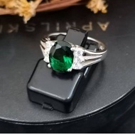 925 Pure Silver Ladies Ring With 7x9mm Green CZ And Six 1.5mm White CZ Stones.