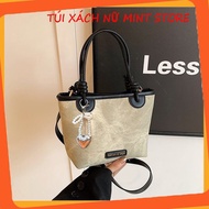 Fashionable women's handbag with beautiful color combinations and a keychain for going out, hand-hel