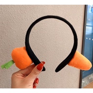 Carrot hair hoops make fun of shark head hoops