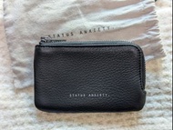 Status Anxiety Left Behind Wallet