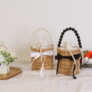Vertical Pearl Handle Rattan Bag