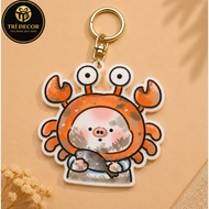 Innocent piglet keychain with bewildered look in a giant crab suit