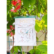 Vintage enameled iron mailbox for garden decoration