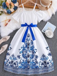 青少女夏季優雅白色細肩帶連身裙，設計有藍白色花卉印花，適合度假和戶外活動