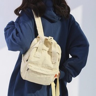 Bei Bao Bao กระเป๋าเป้ผ้าใบสะพายหลังซักได้ญี่ปุ่นวิทยาลัยลำลองเรียบง่ายกระเป๋านักเรียนฮาราจูกุ Kaze กระเป๋าเป้สะพายหลังโรงเรียนมหาวิทยาลัยสูง