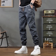 TM Store กางเกงลำลองผู้ชายแบบใหม่ฤดูใบไม้ผลิและฤดูใบไม้ร่วงกางเกงขาจั๊มเก้าส่วนกีฬาหลวมกางเกงชุดทำงา