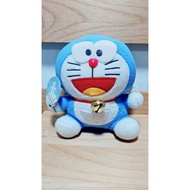 Doraemon teddy bear holding a fan