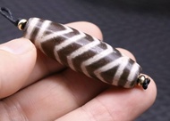 หินทิเบตเขี้ยวเสือและเกลียวคลื่น (Tiger Tooth and Wave dZi Bead)