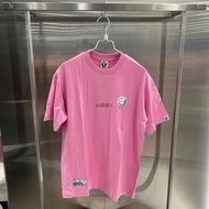 เสื้อผ้าผู้ชายสีเขียวลายคนแคระ Aape เสื้อยืดแขนสั้นตราสัญลักษณ์เรียบง่ายสำหรับฤดูใบไม้ผลิและฤดูร้อน1