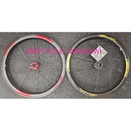 ROLF PRIMA ARES 4 DISC BRAKE CENTER LOCK CARBON WHEELSET WITH ENDURO ZERO CERAMIC BEARING GOLD/RED