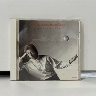 1 CD MUSIC International HUEY LEWIS & THE NEWS/SMALL WORLD (B10D79)