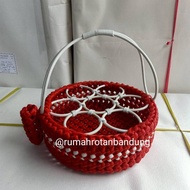 Round diamond pattern aqua basket contains 7 synthetic rattans